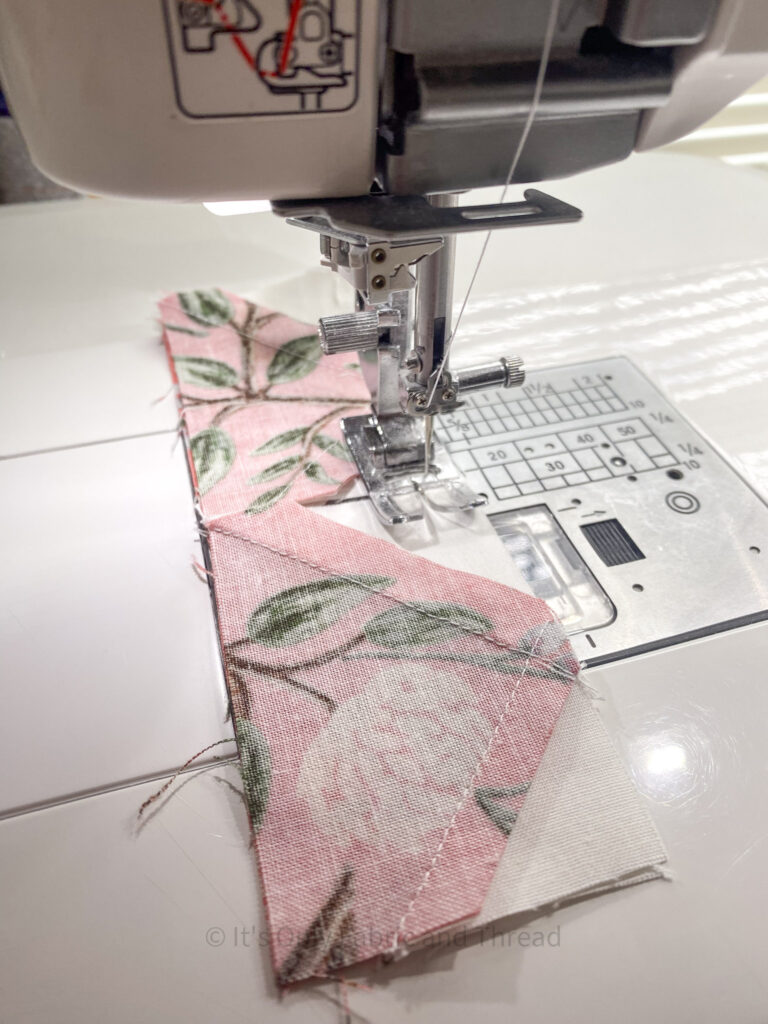 fabric being sewn together using a chain piecing technique
